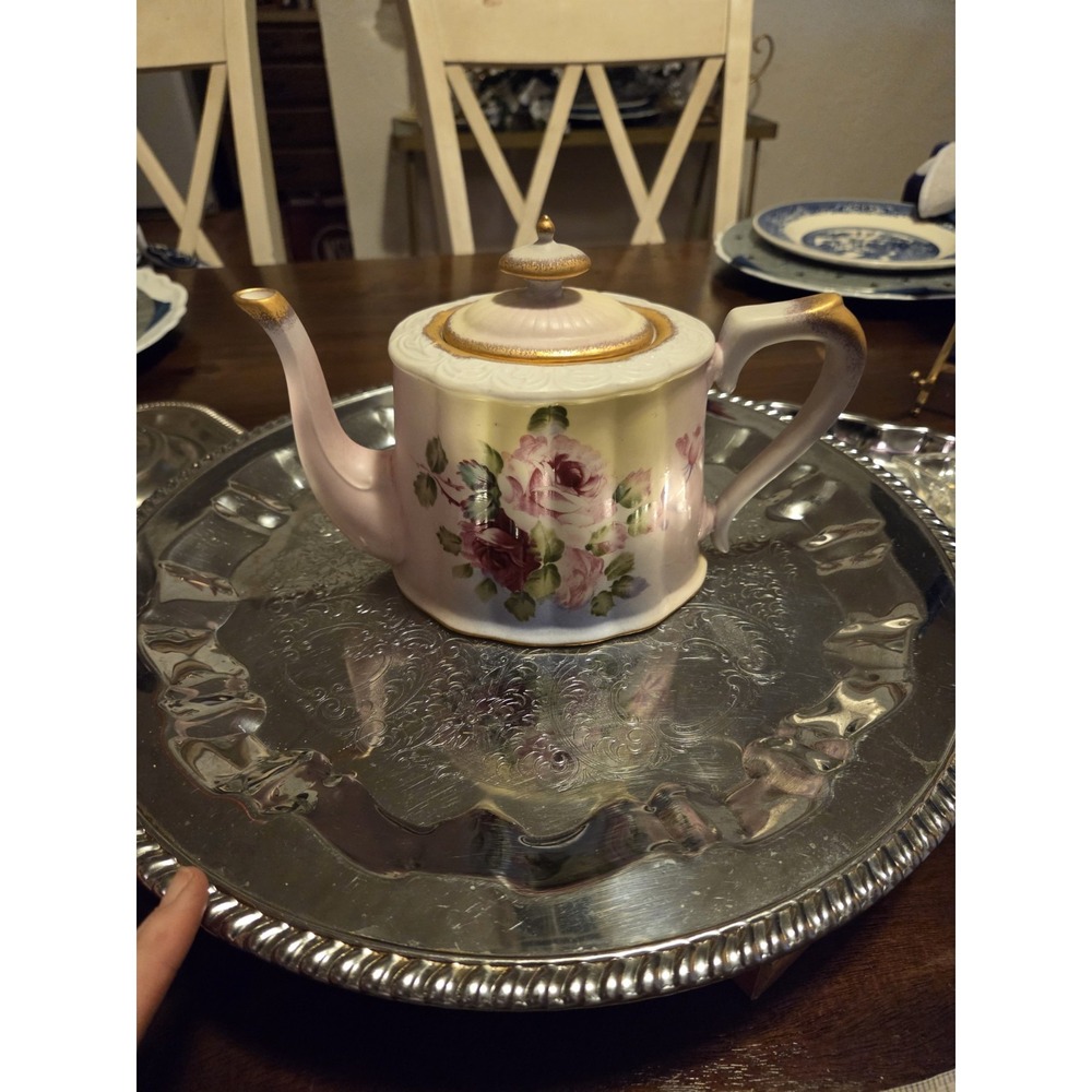 Burton & Burton Teapot characterized by its pale yellow to pink gradient, floral